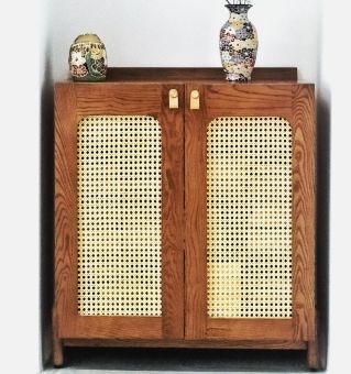 Brown Wooden Cabinet With Flower Vase on Top